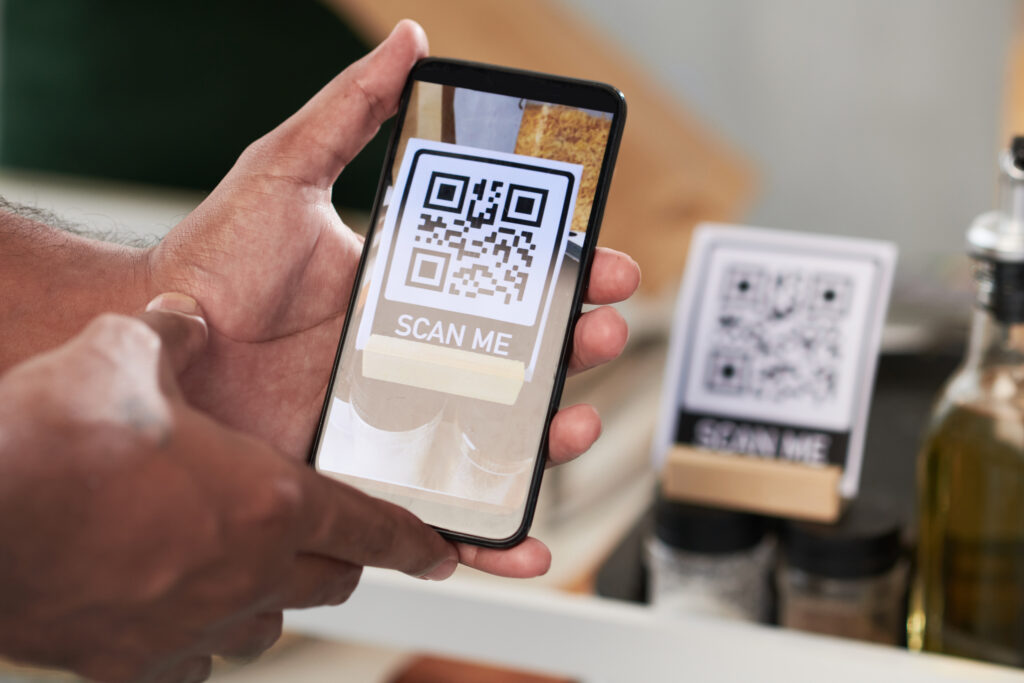 Person scanning a QR-code with a smartphone